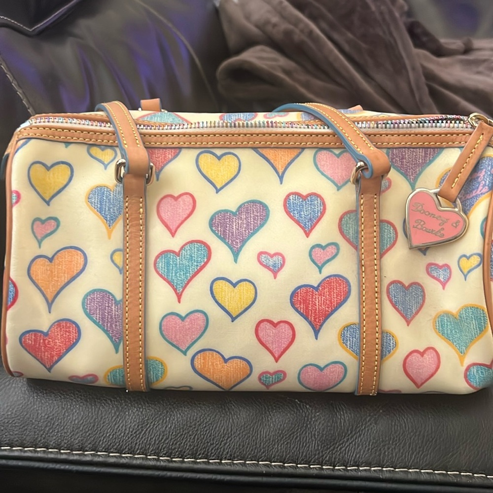 Never used Dooney and Burke heart print bag and wallet. Excellent condition.